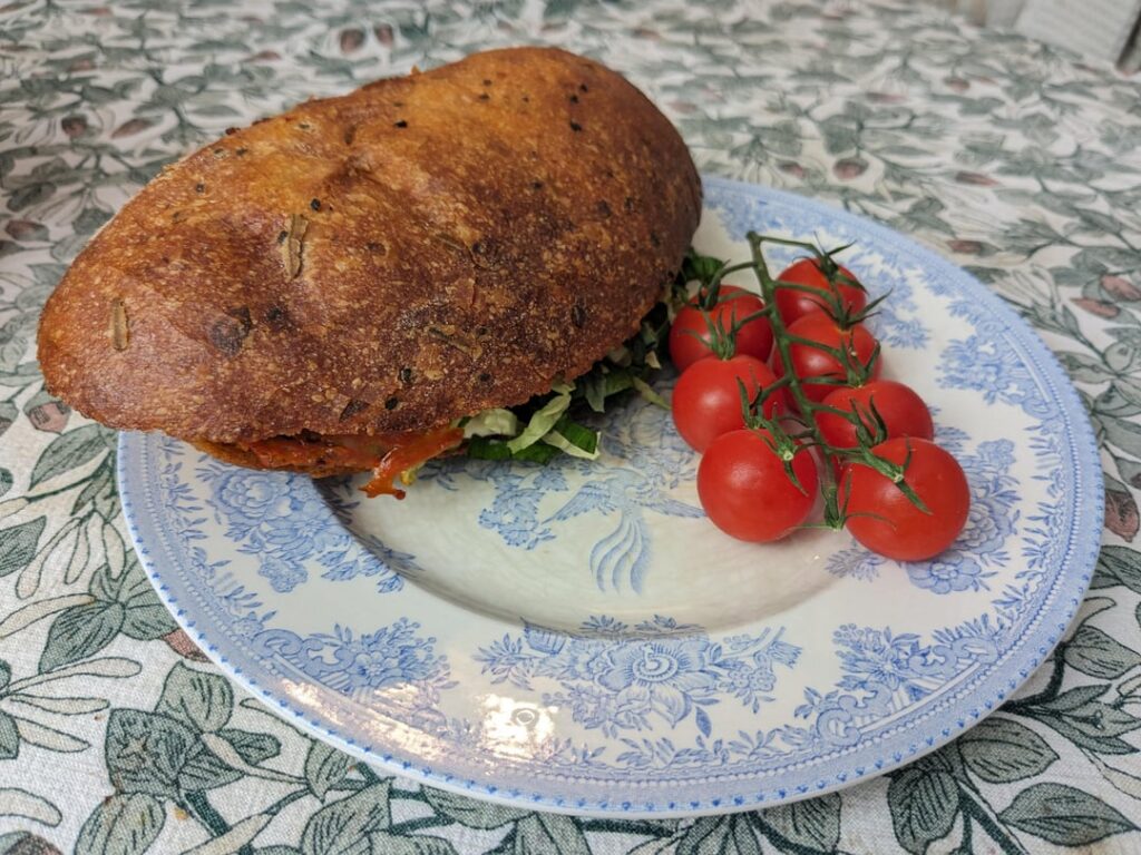 Fried Chorizo and Three-Leaf Salad on Potato and Rosemary Sourdough with Homemade Fennel and Chilli Tomato Sauce