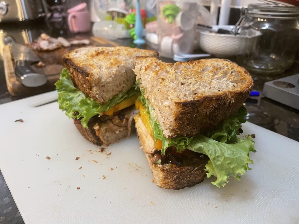 Black pepper/miso grilled chicken thighs, heirloom tomato, lettuce, pickled red onion, miso/ginger/garlic mayo on sourdough