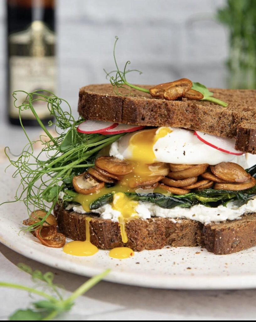Mushroom sandwich with a poached egg for breakfast.