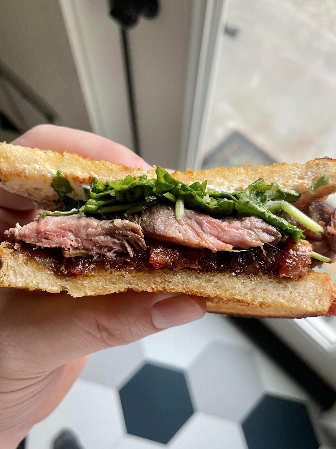 Steak Sandwich. Sous Vide Sirloin, Coffee Jalapeño Bacon Jam, Arugula, Goat Cheese on Sourdough.