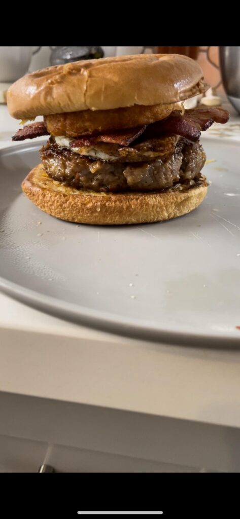 Breakfast sausage with egg and a hash brown