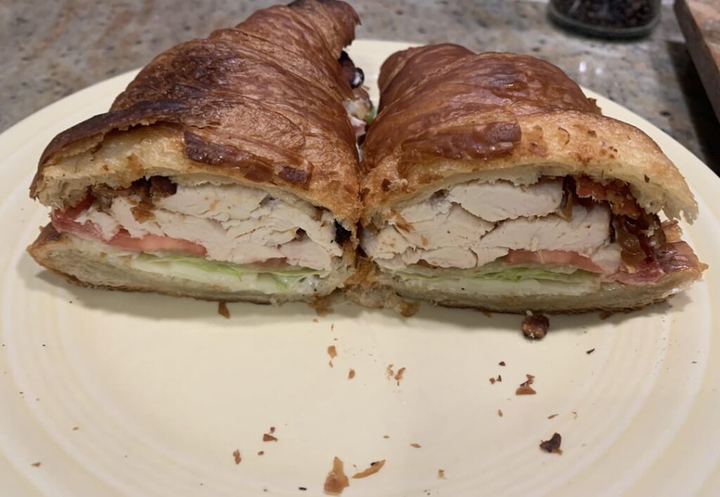 Costco rotisserie chicken on a Costco croissant with BLT, provolone and mayo. It was quite nice.