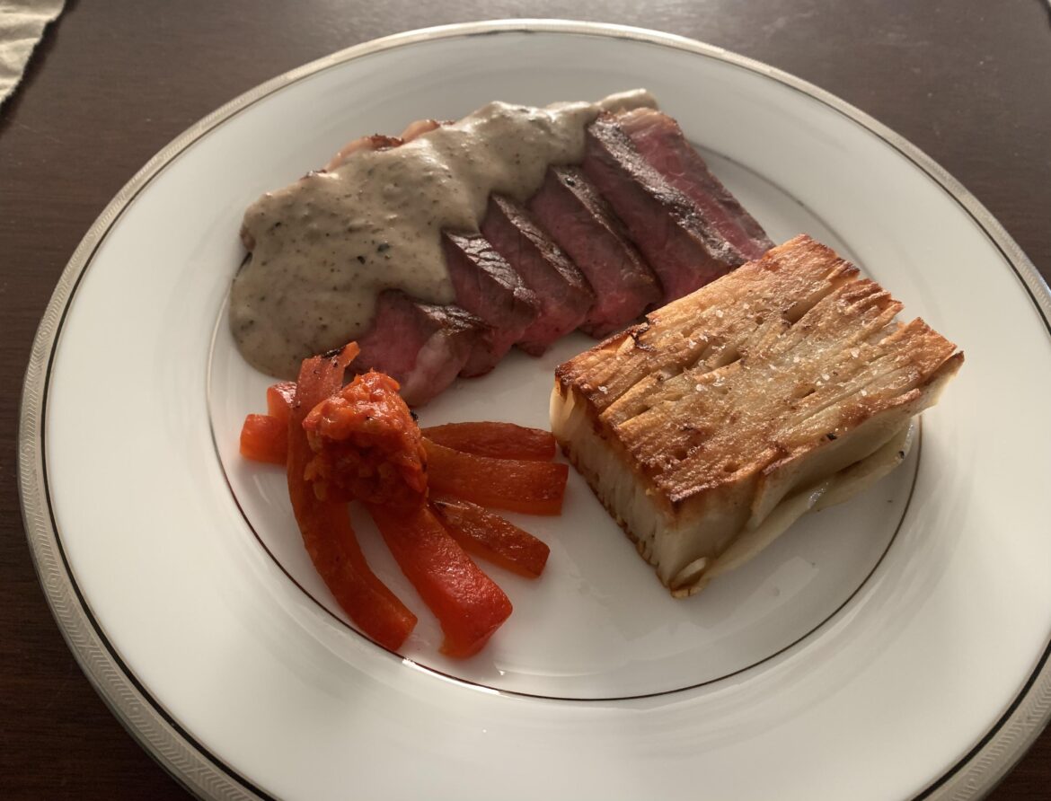 Steak au poivre, pommes pavé and roasted red peppers