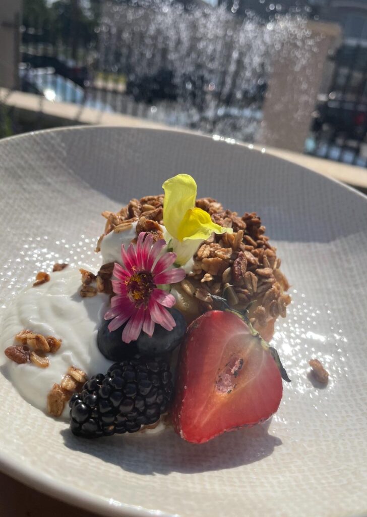 Baked apple with house granola, fresh yogurt and popcorn shoots drizzled with local lavender honey