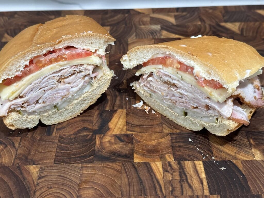 grilled pork loin and habanero jack w/ pickle, onion, tomato, mayo and deli mustard