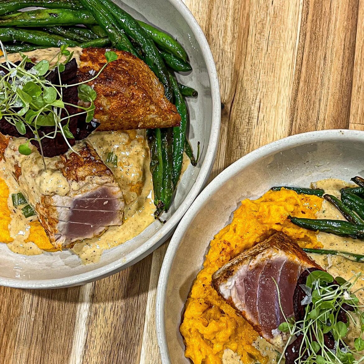 Blackened Tuna Steaks with Monica Sauce over sweet potato purée, beet chips, watercress