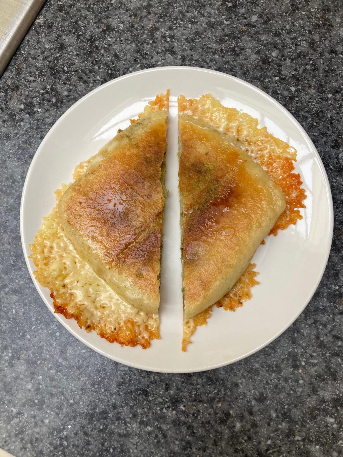 Tried to make a dinner roll work by squishing it between 2 pans... The result: Cheese Skirt-Palooza™