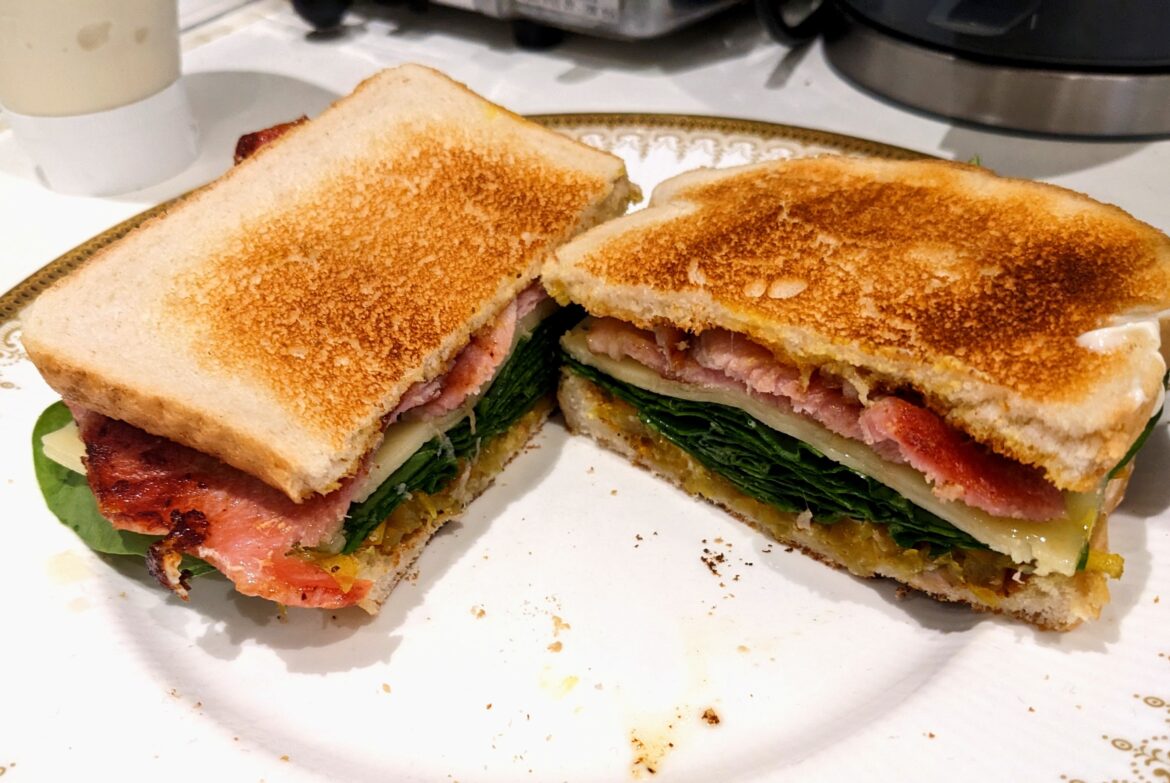 Bacon, fresh spinach, emmental, and my mum's homegrown courgette pickle, on toasted bloomer with English mustard.