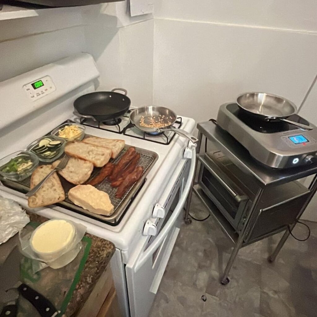 zucchini, corn, garlic, salted ricotta, isigny spring butter, parmigiana reggiano, fermented peppercorns, toasted pine nuts, and honey peppered bacon sandwich