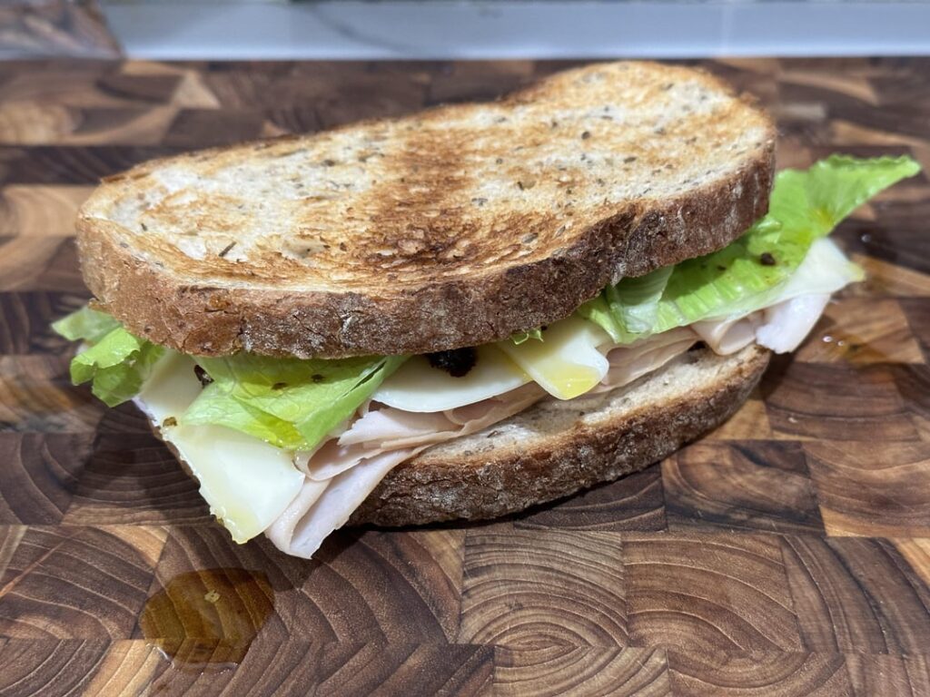 turkey and swiss w/horseradish mustard, onion, lettuce, mayo and sub dressing.
