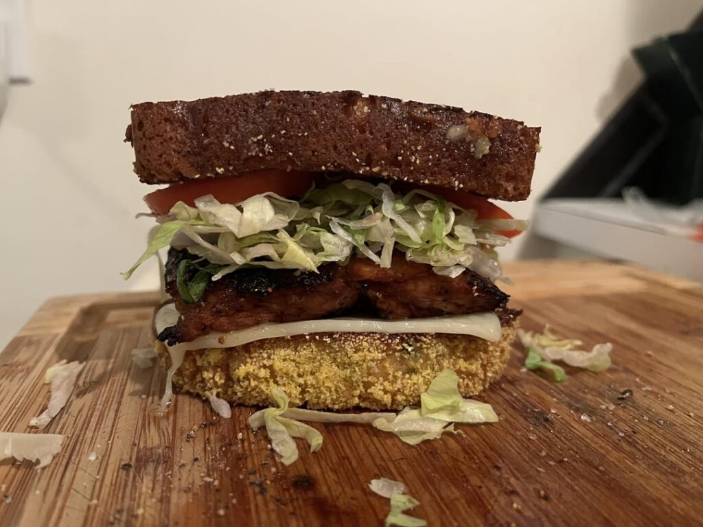 Grilled chicken thigh, Swiss, lettuce and homegrown tomatoes on grilled Jalapeño cornbread.