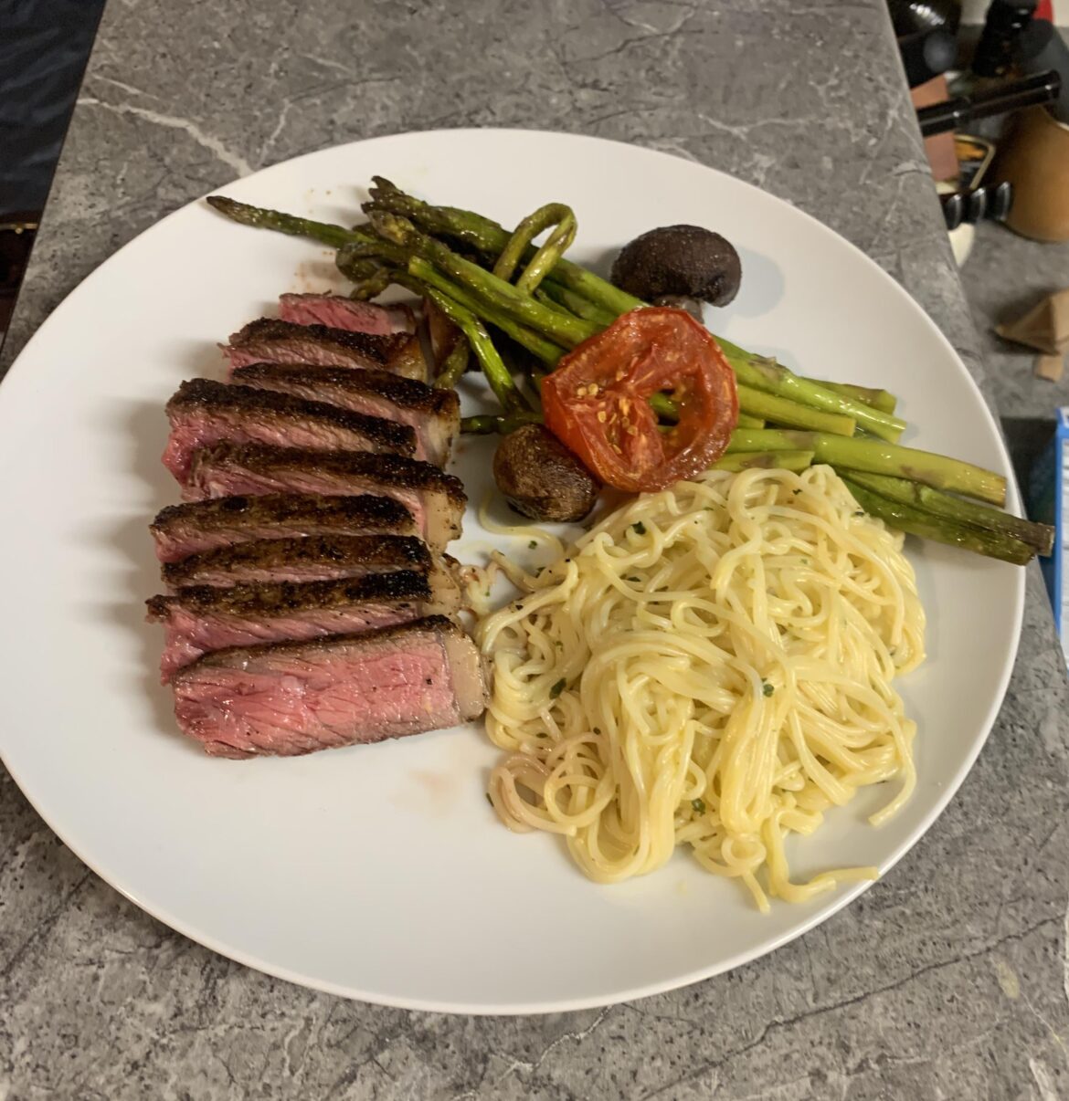 New York strip with asparagus and angel hair pasta