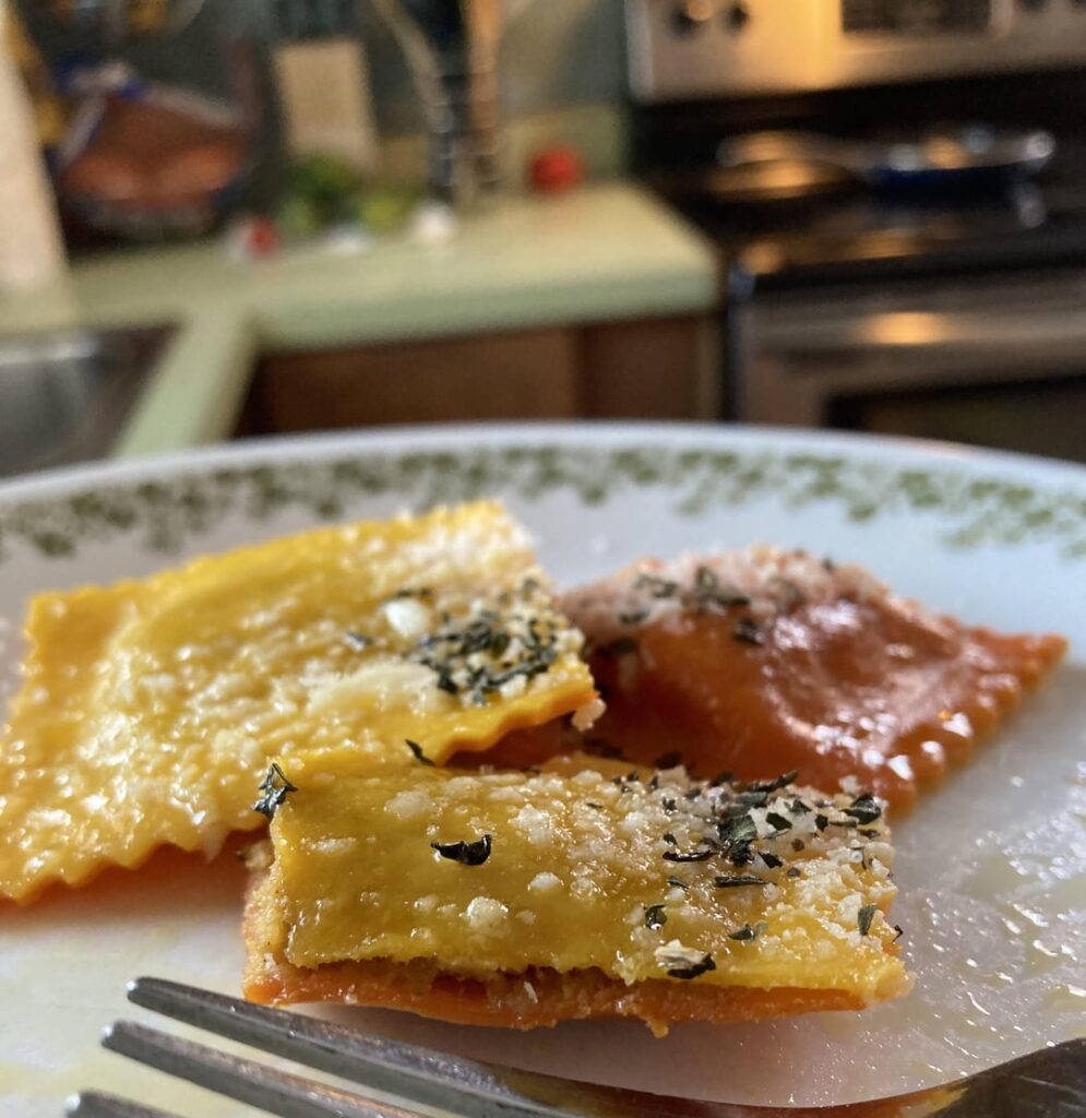 Brown butter cheesy pumpkin ravioli with freshly grated parmesan