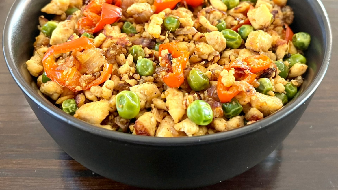 Scrambled Tofu with green peas, red peppers and garlic.