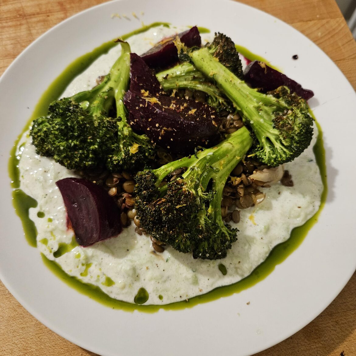 Sous vide beets w/ thyme garlic & lemon peel, charred broccoli, lentils, raita. Parsley oil and fennel pollen to finish.