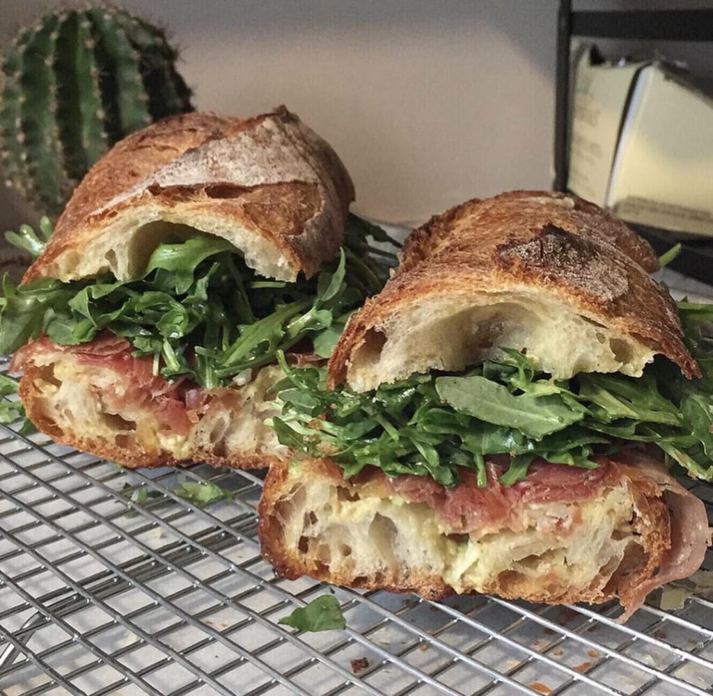 Prosciutto, arugula, cheddar sandwich