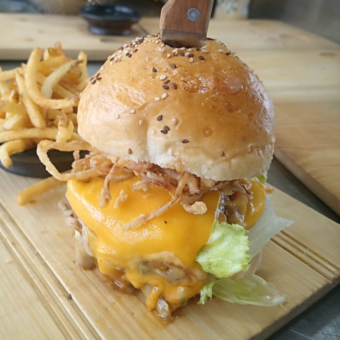 Extra cheesy cheddar burger topped with fried onions