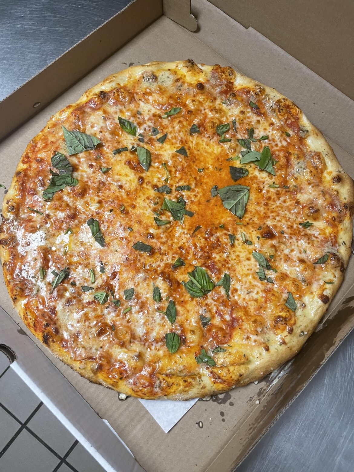 A pie I made with a little extra cheese and a garlic crust. Threw basil on the top because I like the smell