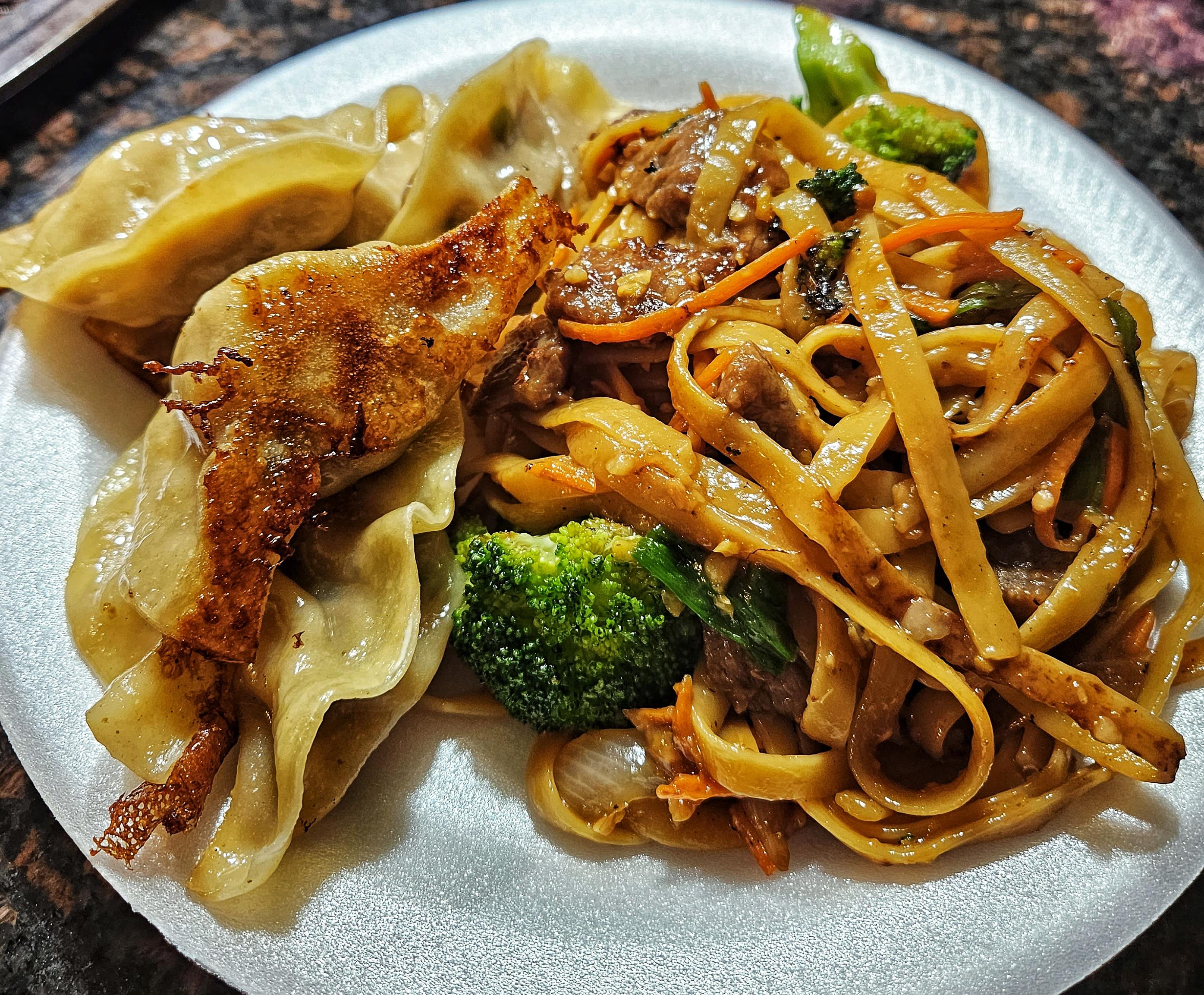 Homemade beef lo mein, pork and shrimp potstickers. Dining and Cooking