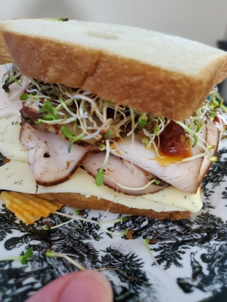 Honey wheat, kewpie mayo, boars's head pitmaster smoked turkey, Dill harvarti, clover sprouts, cheddar sour cream ruffles, herded goat cheese, sundried tomatoes.