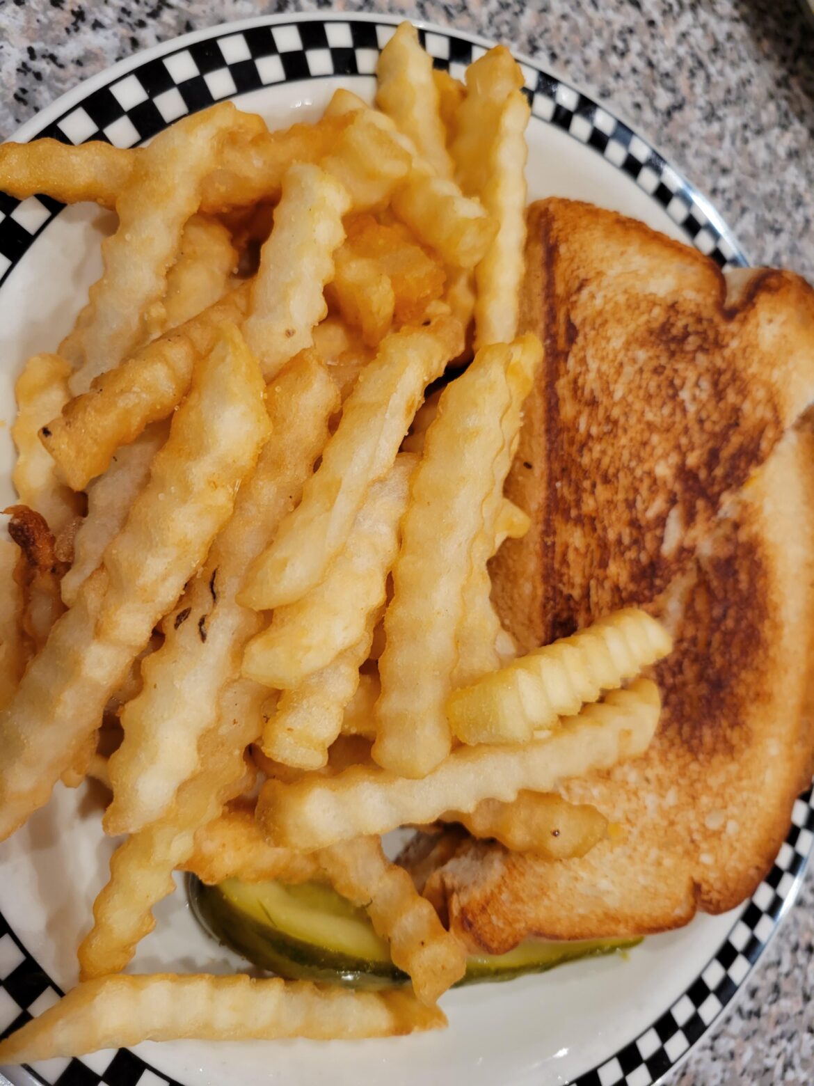 Classic grilled cheese with fries.