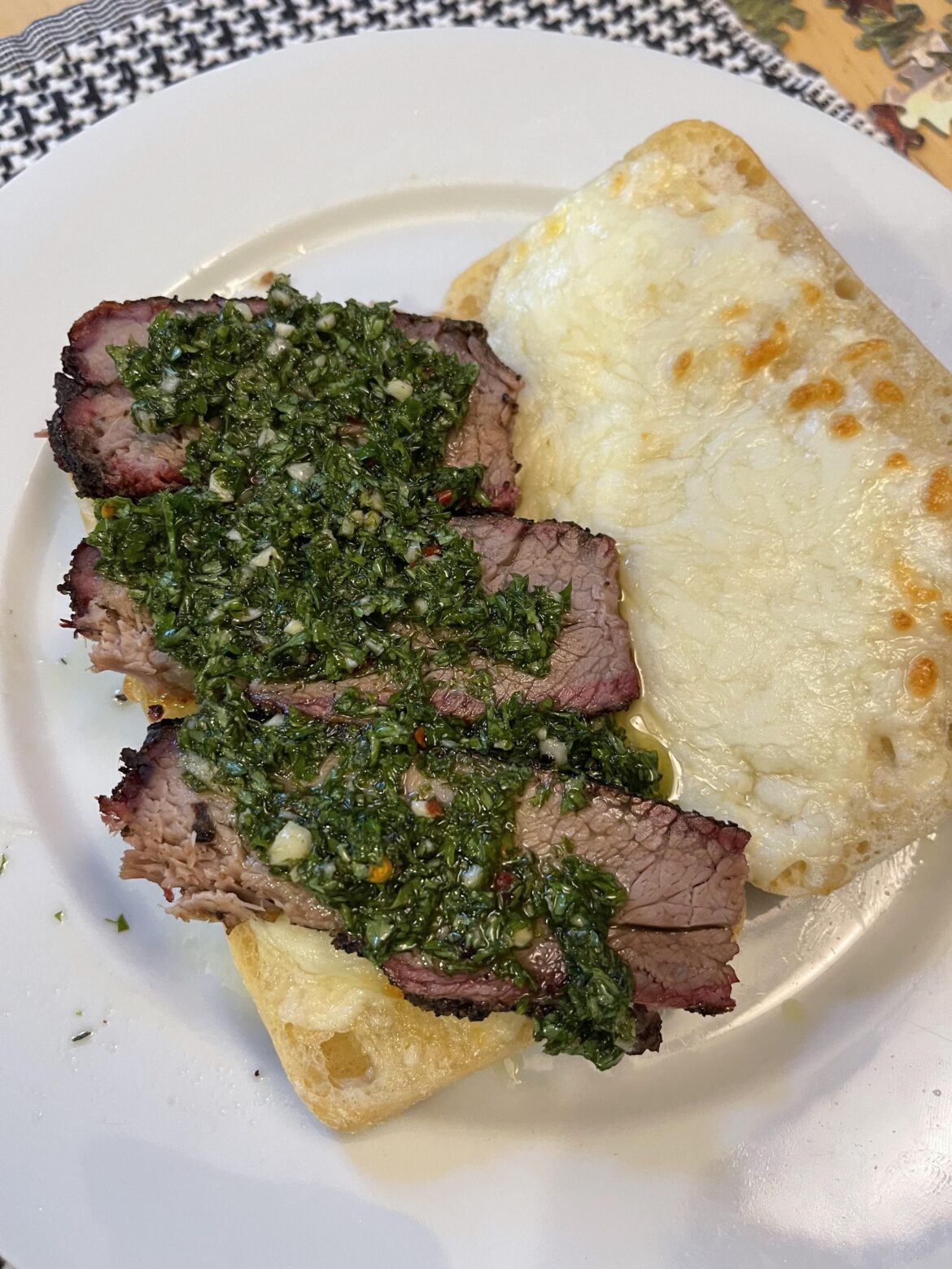 Smoked tri tip, chimichurri and mozzarella on a chibata.