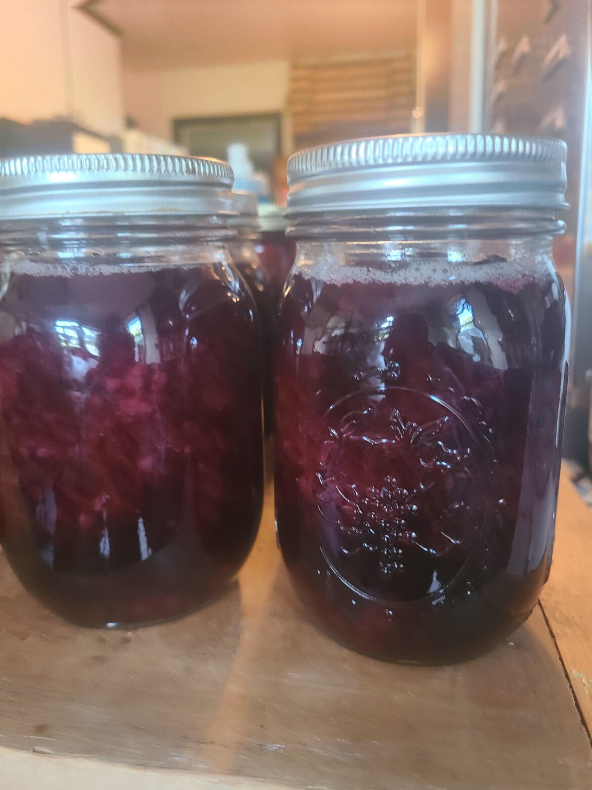 Ball blackberry liquer has white bubbles after canning?