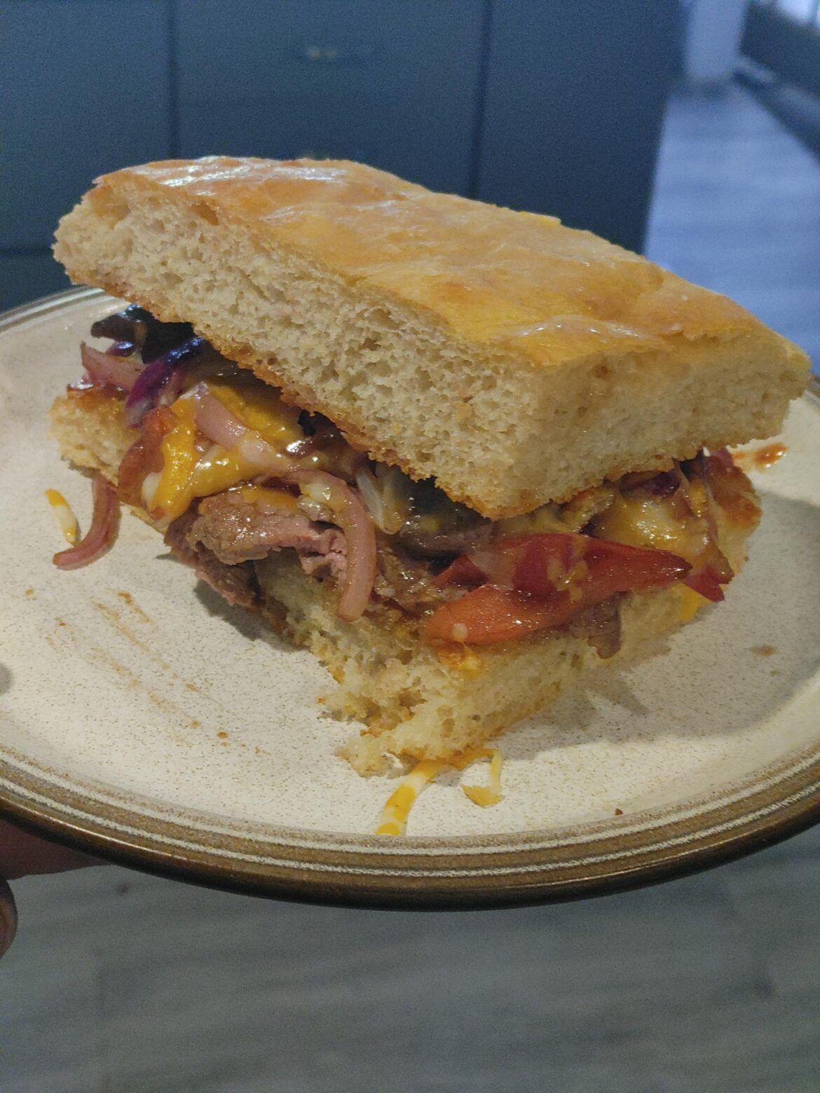Balsamic steak sandwich with flank steak, Roma tomatoes, and red onion. On a homemade not-quite focaccia bread Balsamic steak sandwich with flank steak, Roma tomatoes, and red onion. On a homemade not-quite focaccia bread