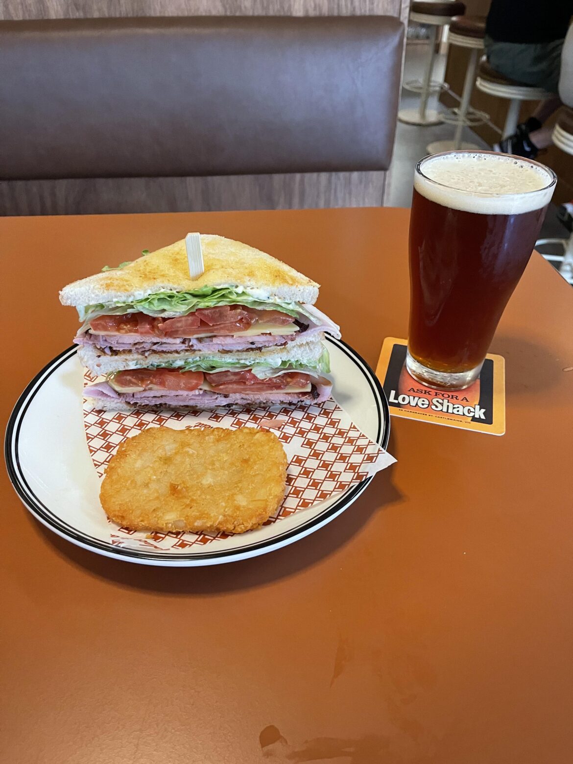 Bacon, smoked ham, bacon jam, Swiss cheese, tomato, lettuce, Mayo on white bread with a cheeky hash brown and a Red IPA