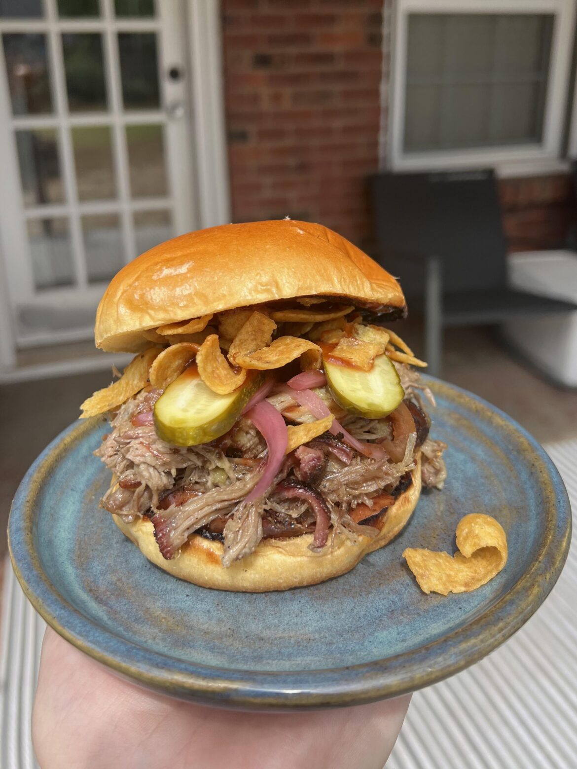 Homemade pulled pork and sausage sandwich.