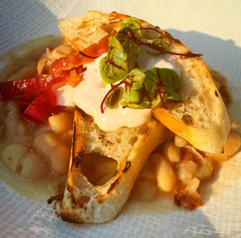 Italian cannellini bean with smoked ham hock, crisp ciabatta bread, baby sorrel, peperonata & labneh