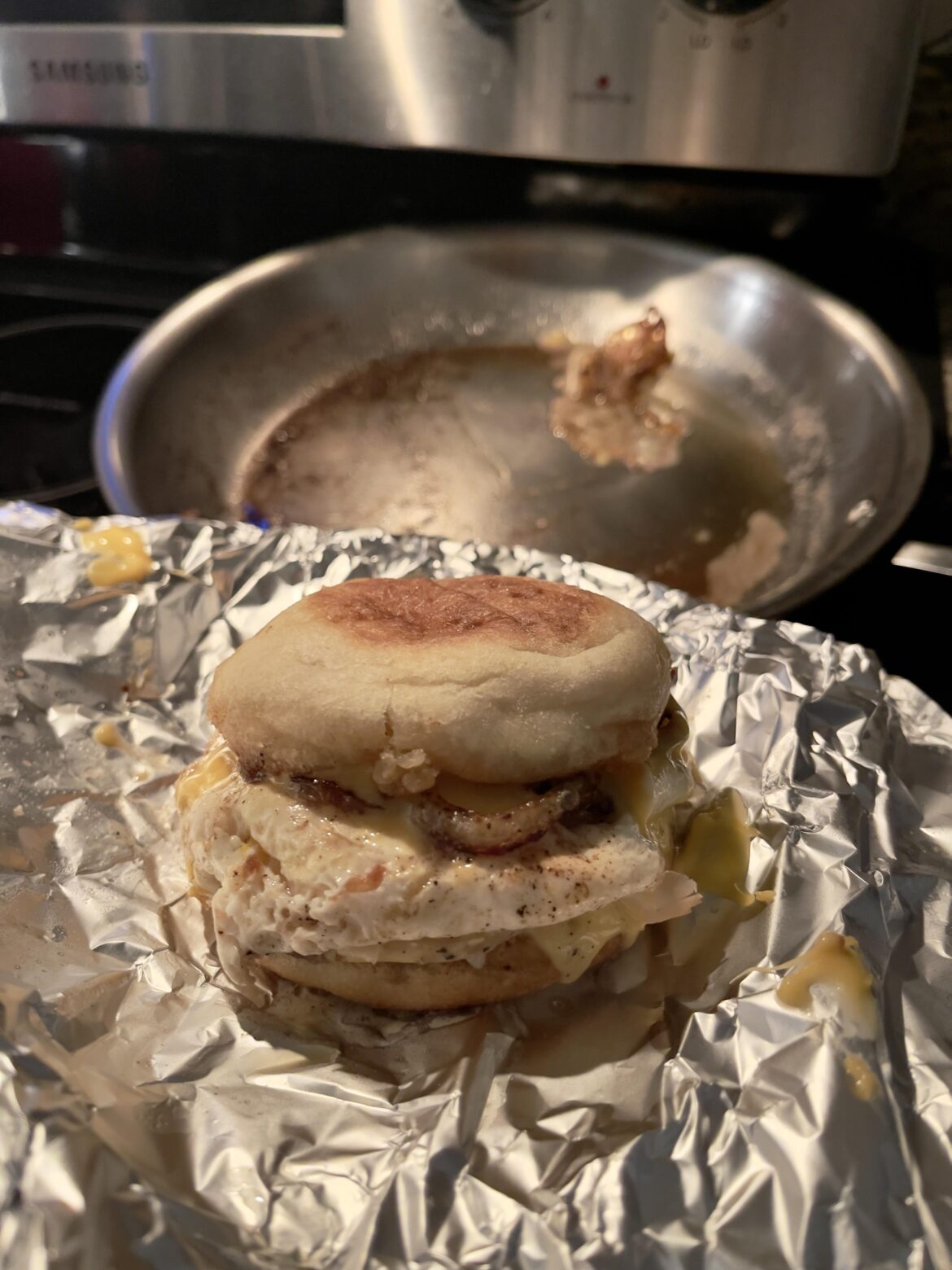 Breakfast English muffin: pork tenderloin, egg, American, sour cream, cilantro, sautéed onion