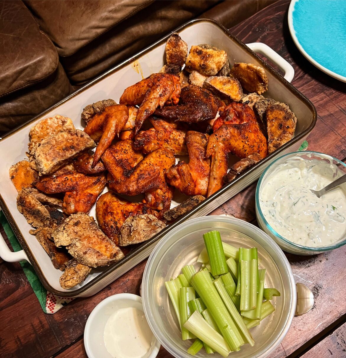baked hot buffalo wings, crispy sweet potatoes, greek yogurt blue cheese dip, & celery