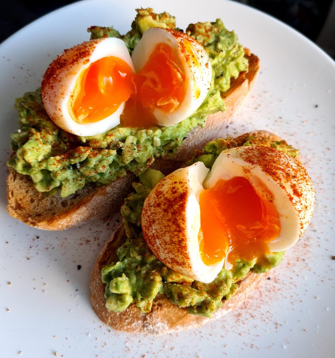 smashed avo on toasted sourdough with soft boiled eggs and smoked paprika.