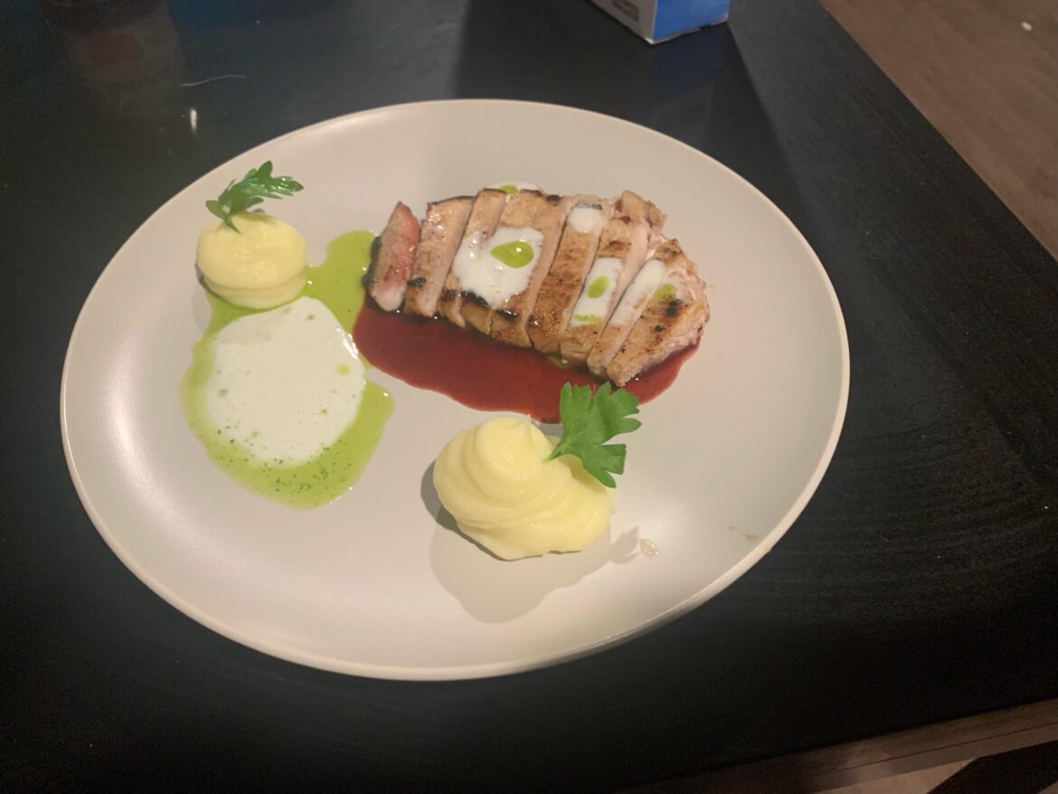 Brined pork chop, blackberry tangerine gastrique, pomme purée, parmesan foam, herb oil