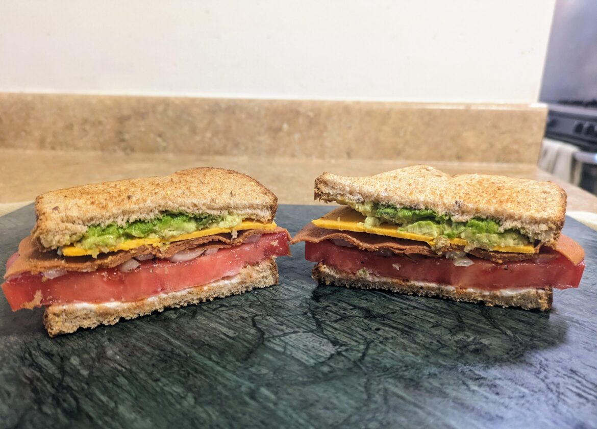 Toasted multigrain, thick farmers market tomato, smokehouse plant provisions deli slices, daiya cheddar, onion, smashed avocado, mayo, tabasco sriracha, and plenty of s&p of course