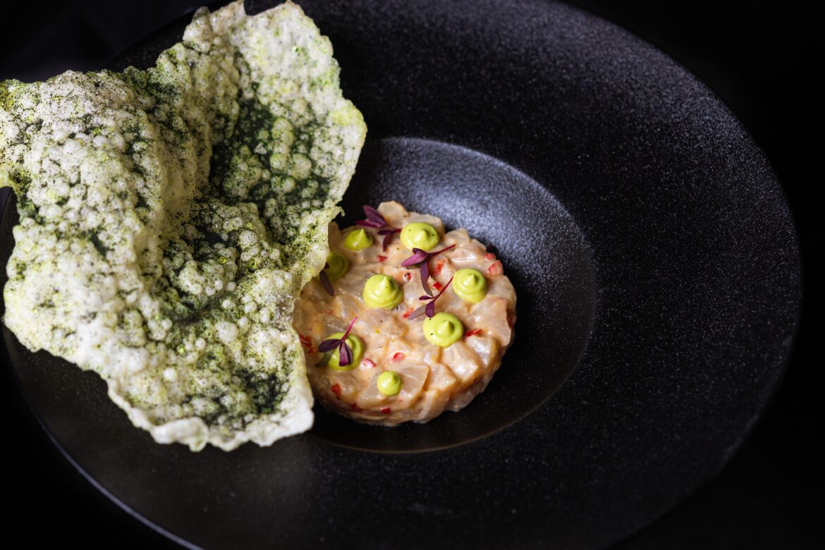 Kingfish crudo, coconut, lemongrass and ginger dressing, Thai basil and kaffir lime avocado purée. Wakame tapioca crisp.