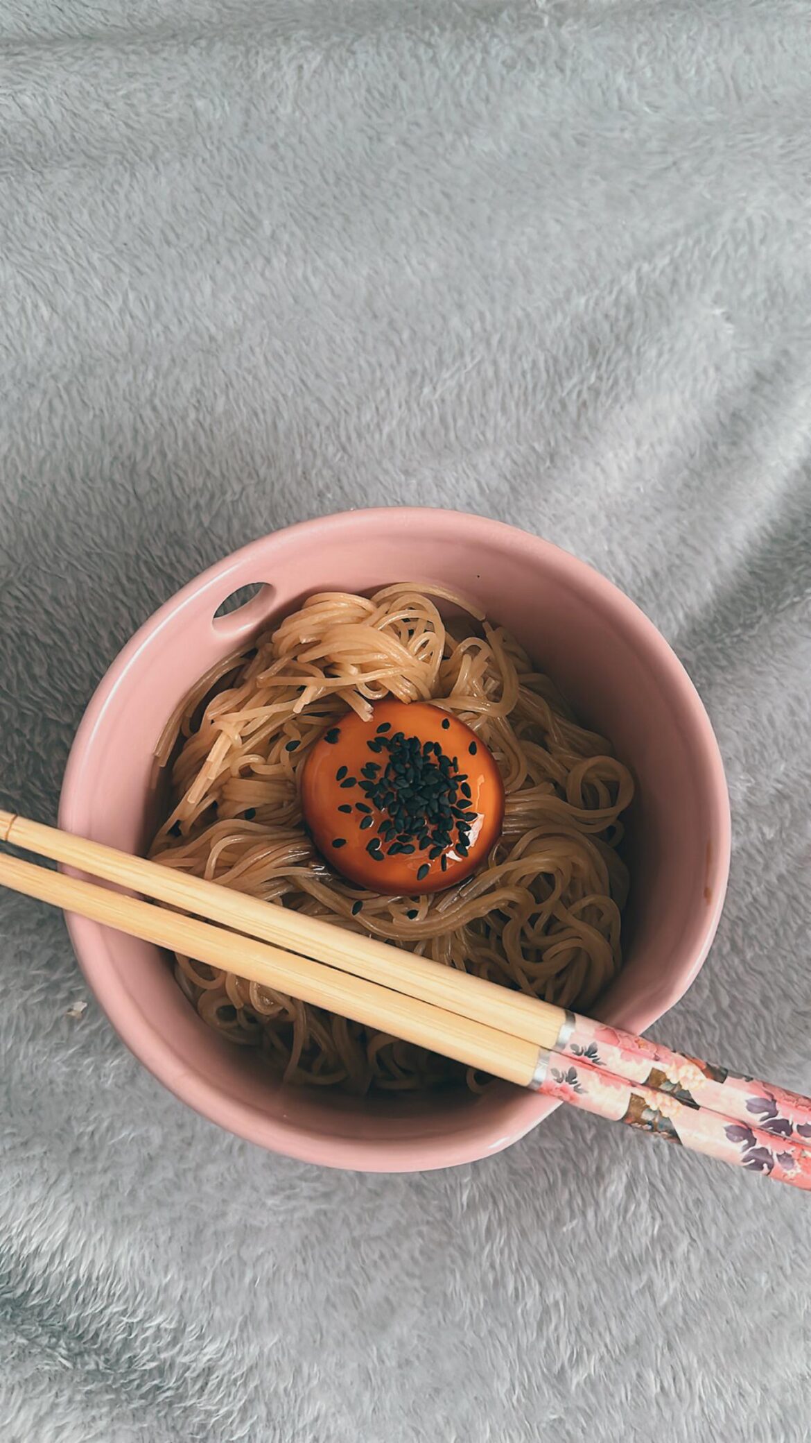 Naengmyeon noodles with coconut aminos sesame oil salt and brown sugar. Marinated egg yolk.