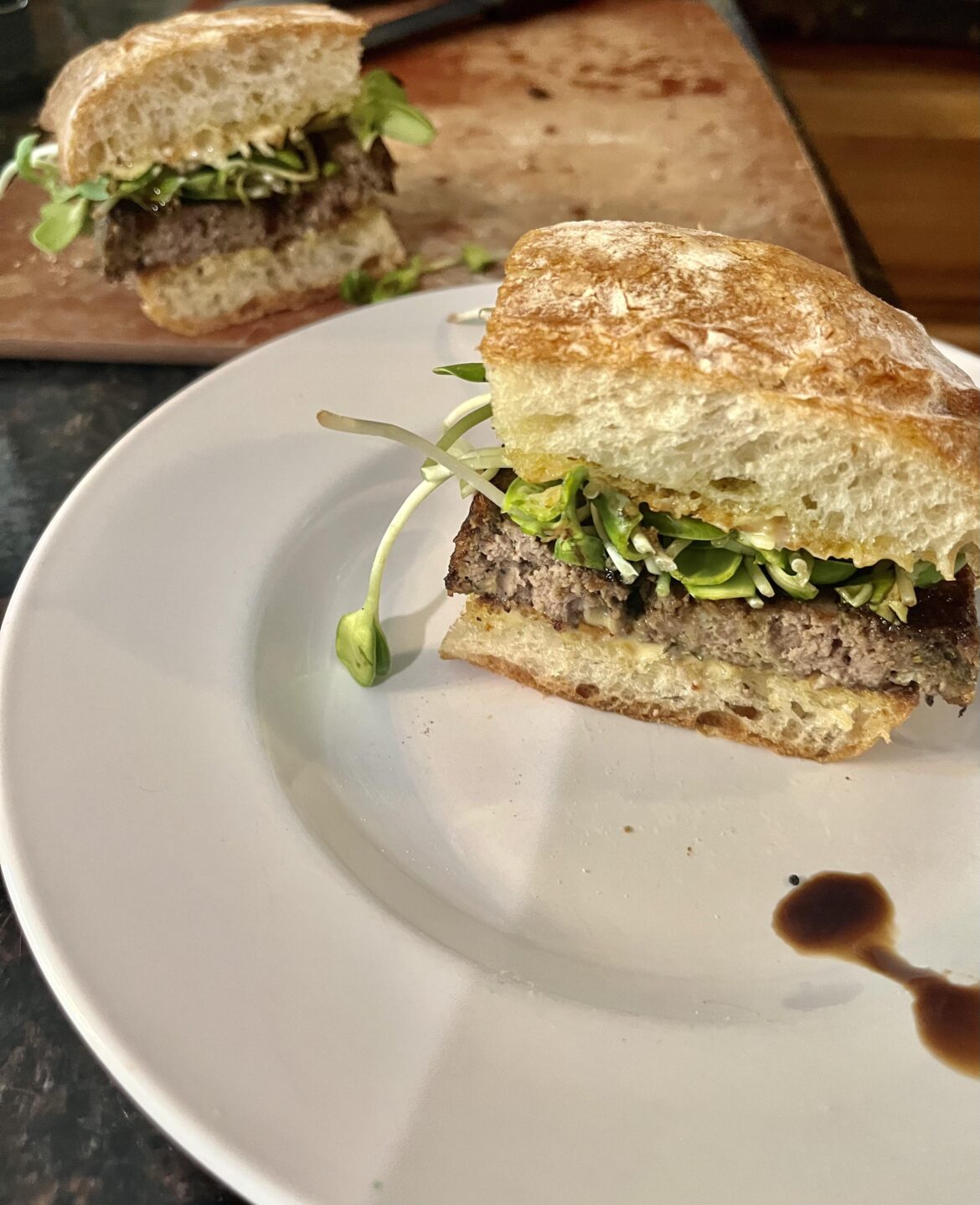 Leftover Polpettone on ciabatta with garlic confit aioli, sunflower sprouts, and balsamic!