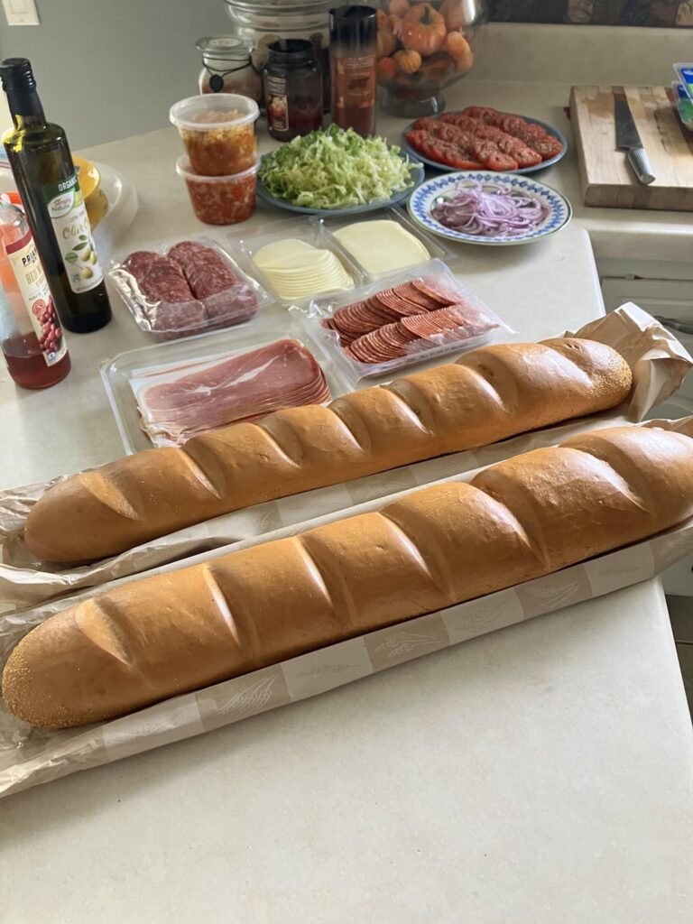 Couple of sandwiches for Thursday night football tailgate. Salami, spicy salami, prosciutto and ham with provolone, mozz, LTO, oregano and banana pepper relish or artichoke sweet pepper relish