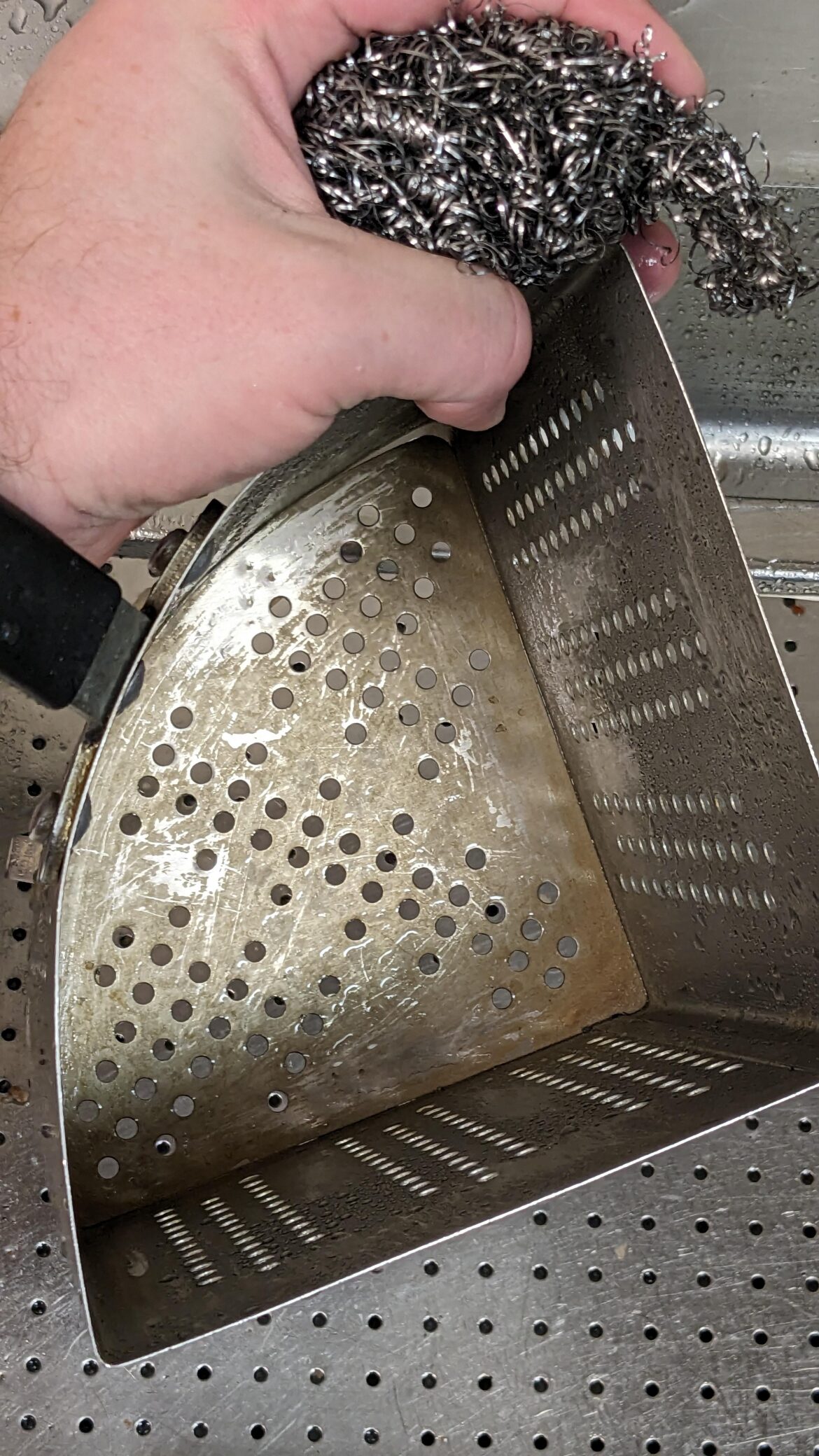 Best way to remove this rock hard "pasta scum" from these boiling baskets? other than cutting up my arms and fingers cramming steel scrubbies into this wonderful shape