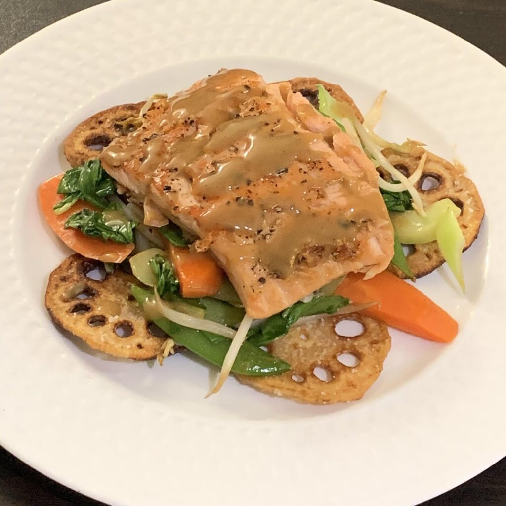Miso Salmon a la Nage; stir fried bok choy, carrots, snap peas, and bean sprouts; fried lotus chips; reduced miso broth sauce