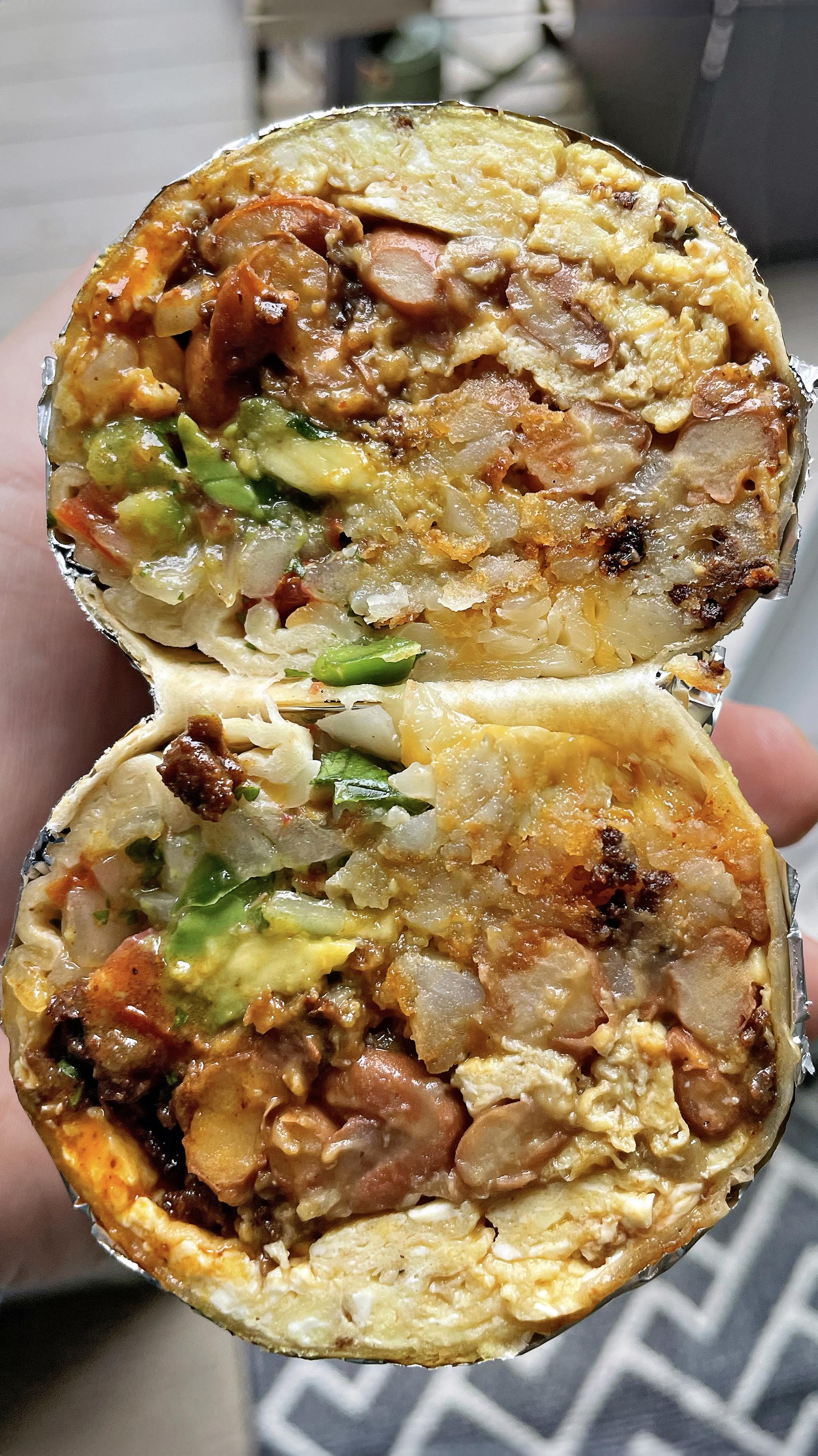 Breakfast burrito with homemade chorizo, scrambled eggs, cheese, beans