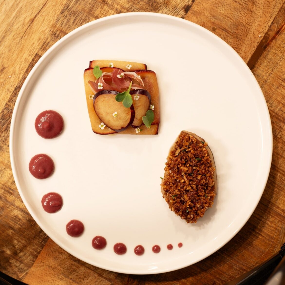 Humm's dish: Foie gras, seared; duck skin shallot crumble; plum-foie puree; plum pickled in sloe vinegar; duck prosciutto (aged 2 weeks); alyssum flowers