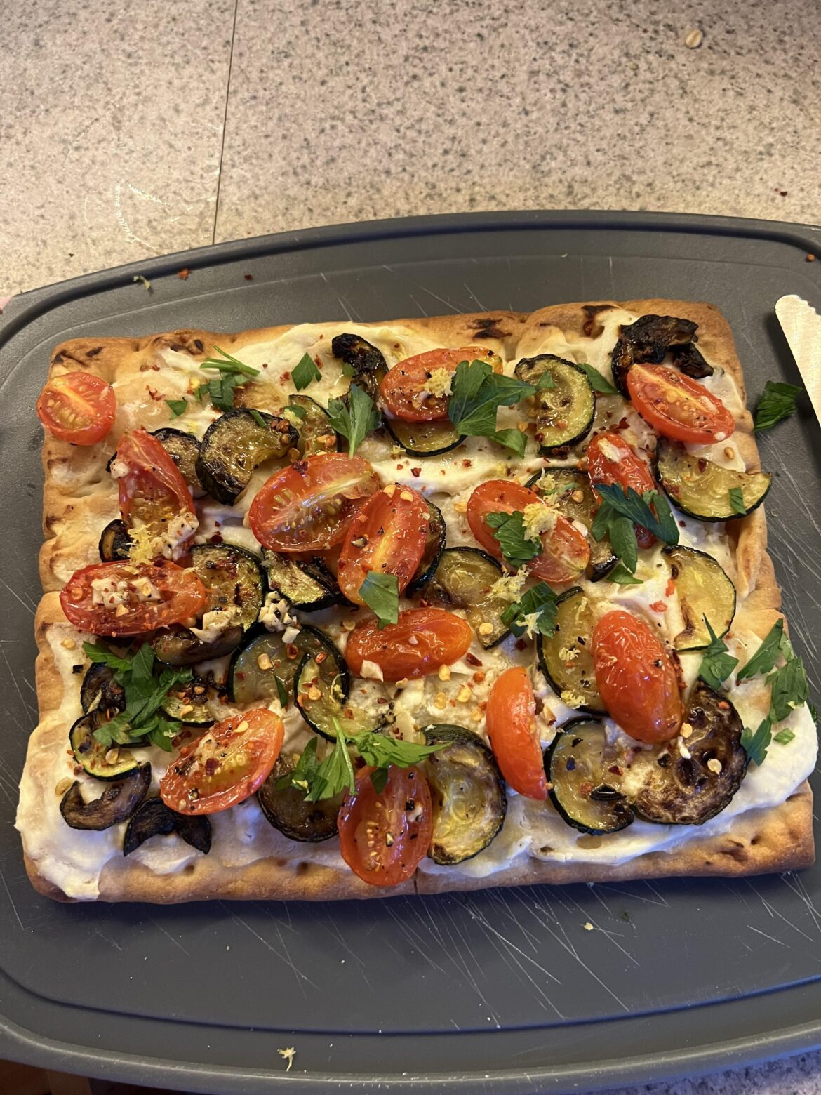 Zucchini and tomato flatbread. One of my favorites 😋