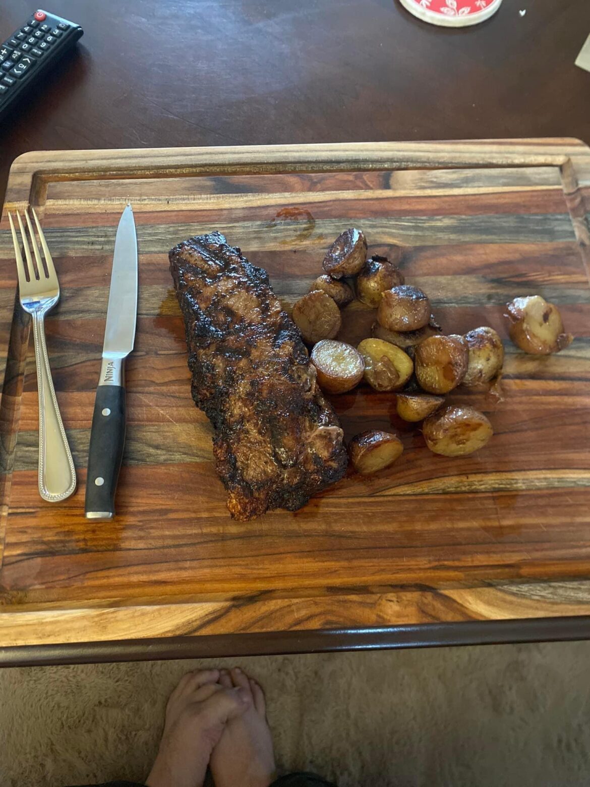 A yummy meal on wood with a side of feet