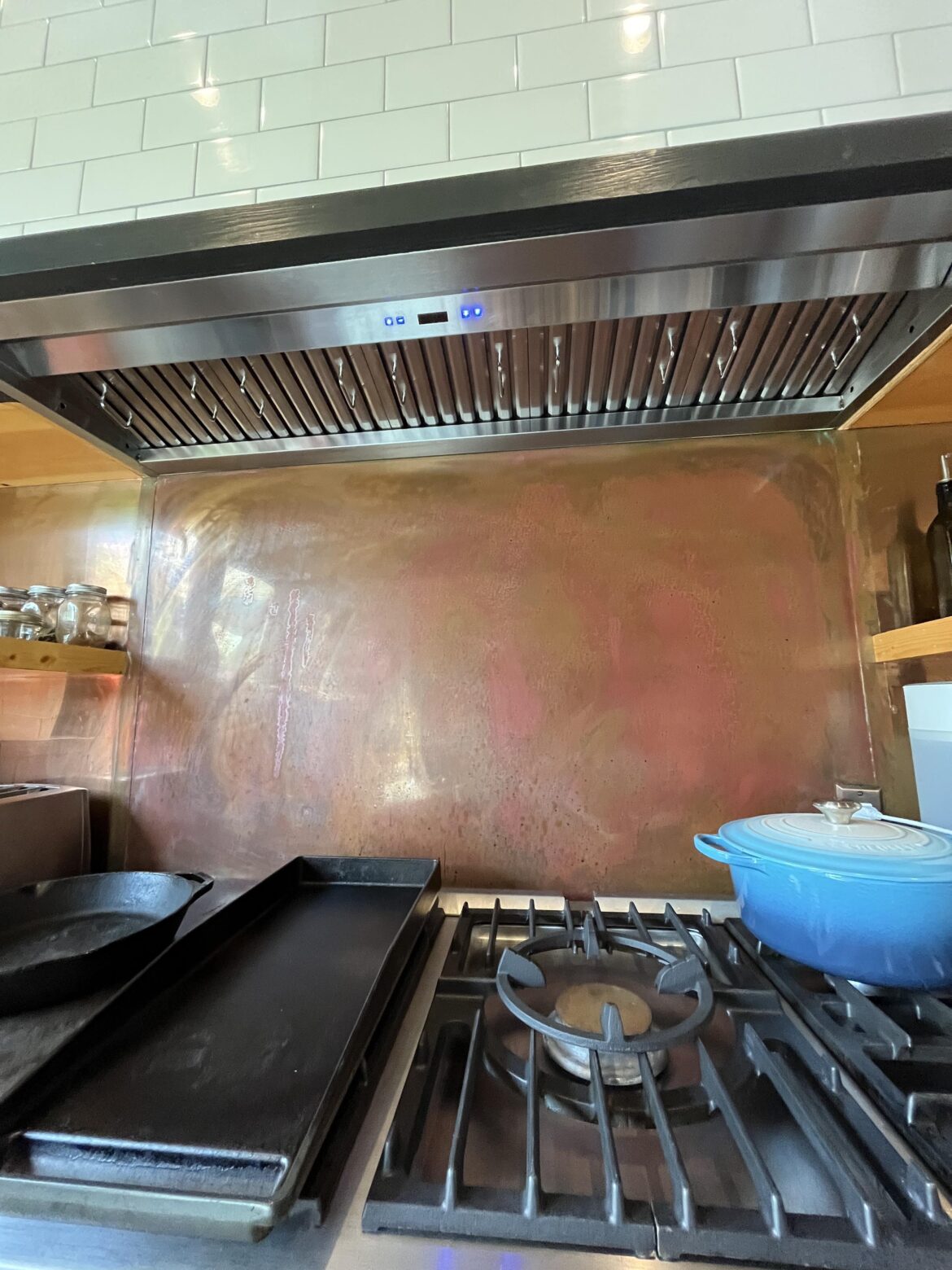 My new house has this vent hood. Other than turning it on, do I need to mess with these metal pieces on the hood? Do they need to be physically opened while cooking?