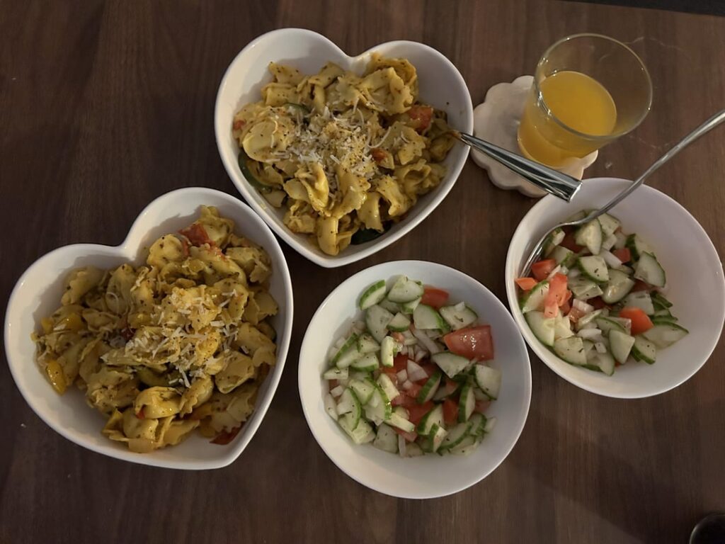 Mediterranean tortellini with pesto sauce and roasted veggies