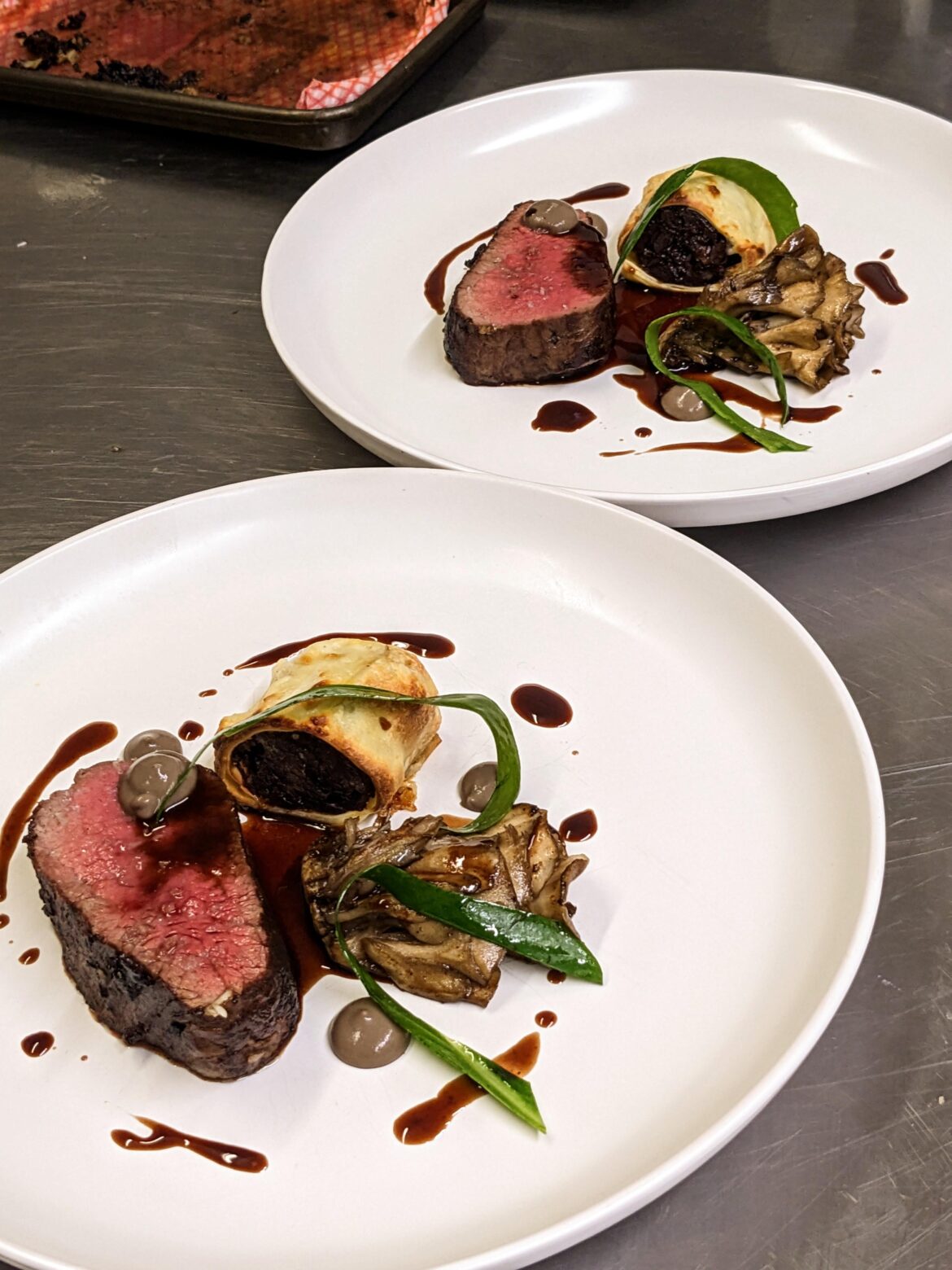 beef poached in tallow to 52c hen of woods, wild garlic, mushroom ketchup, oxtail canneloni, oxtail jus. in north yorkshire