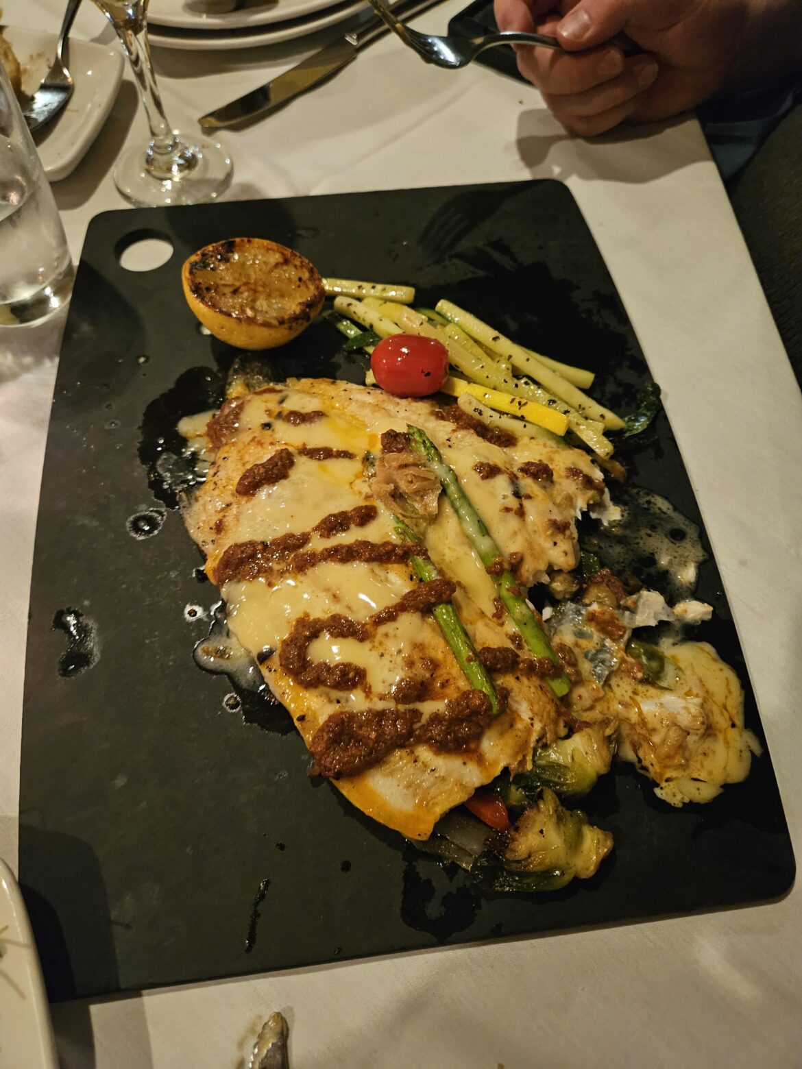 This place was fancy but they put his trout on a cutting board